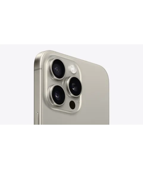 Angled close-up of the Pro camera system on the Apple iPhone 15 Pro Max in Natural Titanium