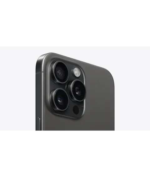 Angled close-up of the Pro camera system on the Apple iPhone 15 Pro Max in Black Titanium