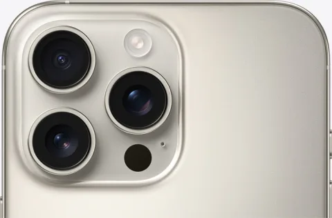 iPhone 16 Pro Max in Natural Titanium, triple-camera module detail