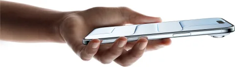 Apple iPhone Air in Sky Blue, held flat in hand showing thin profile