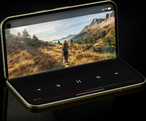 Google Pixel 11 Pro Fold in Olive, unfolded and propped up in tabletop mode, 3/4 angle