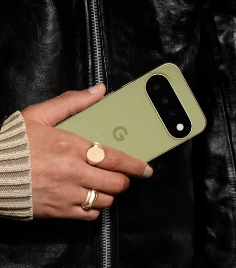 A person holding Google Pixel 11 in Pistachio.