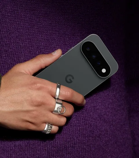 A person holding Google Pixel 11 in Obsidian.