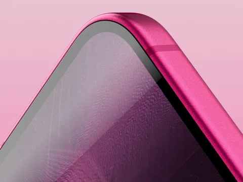 A closeup of the gleaming Pixel 11 display and polished edge.