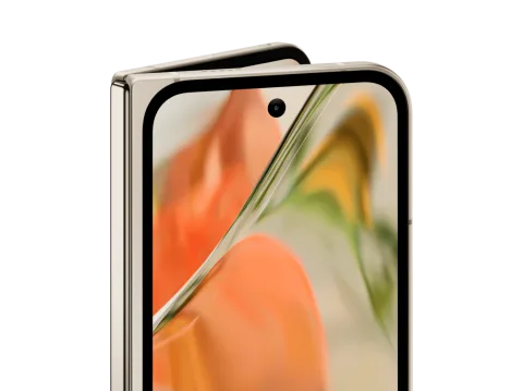 Angled close-up of the front screen of Pixel 9 Pro Fold in Porcelain color. The the internal screen peaks out over the top.