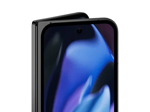 Angled close-up of the front screen of Pixel 9 Pro Fold in Obsidian color. The the internal screen peaks out over the top.