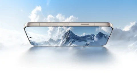 Honor 600 in Golden White lying flat, display showing mountain scene