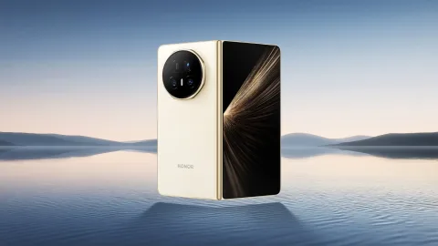 Honor Magic V5 folded, White colourway, standing on a beach