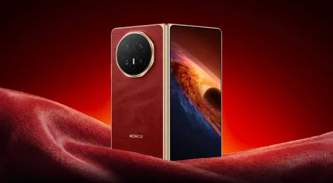 Honor Magic V6 in Red, opened at an angle showing the front display and rear camera module