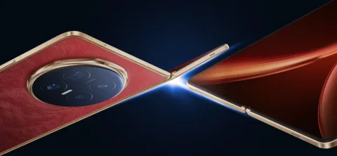Honor Magic V6 in Red, angled close-up of the quad camera module and hinge edge