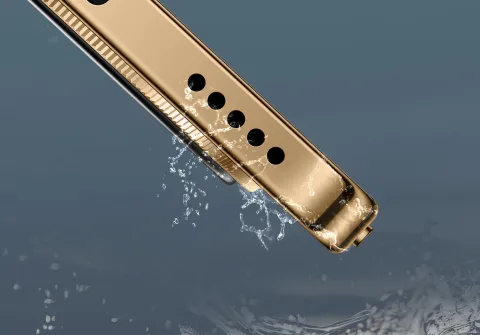 Macro shot of Honor Magic8 Lite speaker grille with water droplets