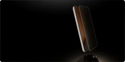 Honor Magic8 Pro in Sunrise Gold, side angle showing the protective glass layer lifting off the display