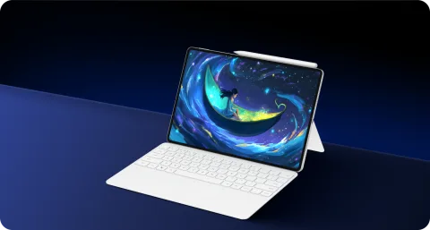 Honor MagicPad 4 with keyboard on dark surface, galaxy wallpaper