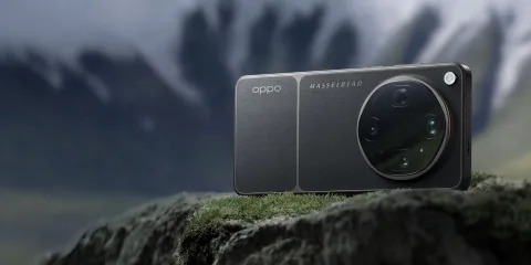 Oppo Find X9 Ultra in Tundra Umber resting on a rock outdoors, Hasselblad camera module visible