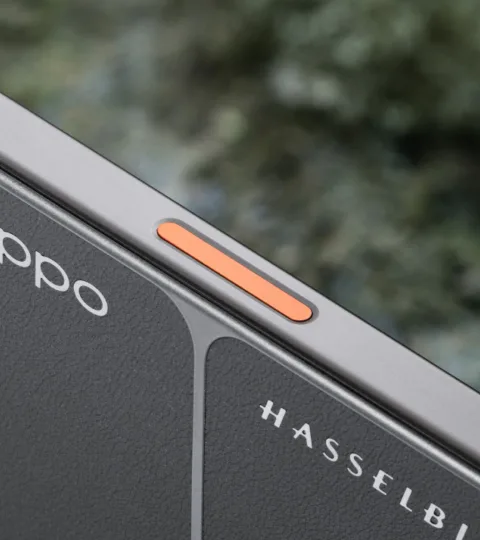 Oppo Find X9 Ultra top corner detail: camera control button, Hasselblad and OPPO branding
