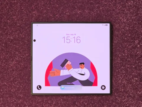 Samsung Galaxy Z Fold8 Ultra in Graphite, unfolded flat on a table, Flex Titanium hinge leaves minimal crease across the main display
