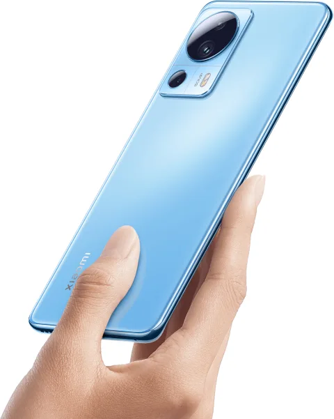 Xiaomi 13 Lite in Lite Blue, back view held in hand