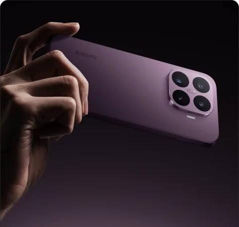 Hand holding the Xiaomi 17T in Violet, camera module visible