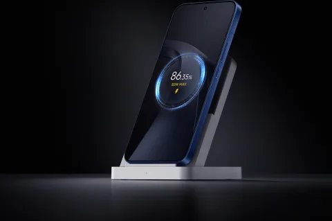 Xiaomi 17T Pro on a charging stand showing battery percentage on screen