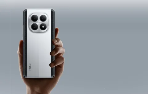 POCO M8 held in both hands showing full rear view
