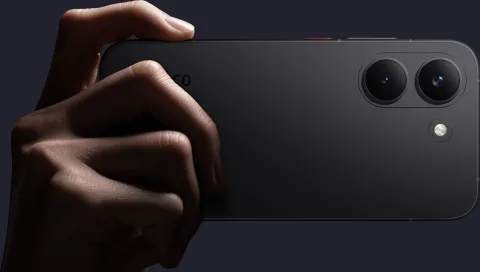 POCO X8 Pro held in hand, side angle showing camera bump detail