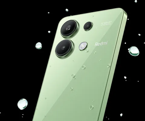 Redmi Note 13 in Mint Green, back view with water splash