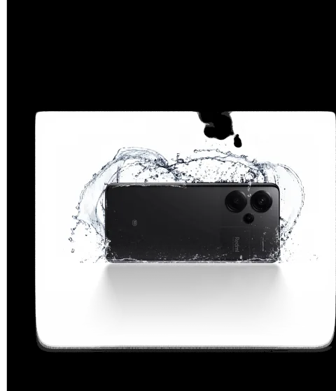 Redmi Note 13 Pro+ in Midnight Black, back view with water splash