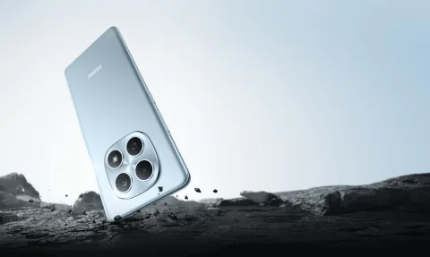 Redmi Note 15 in Glacier Blue, back view on rocky terrain
